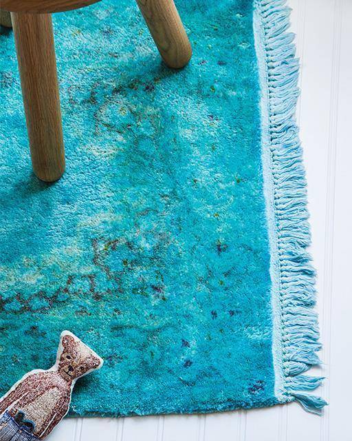An old rug has been painted blue.