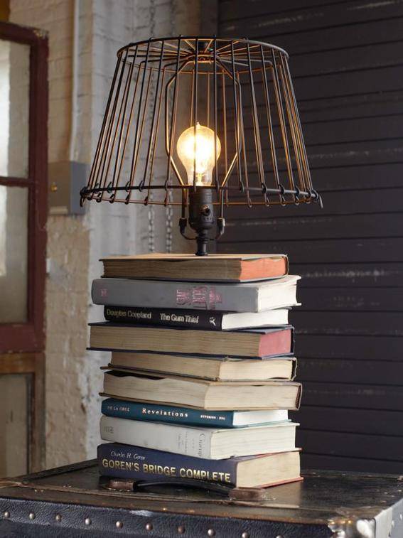 The base of a lamp is made from stacked books.