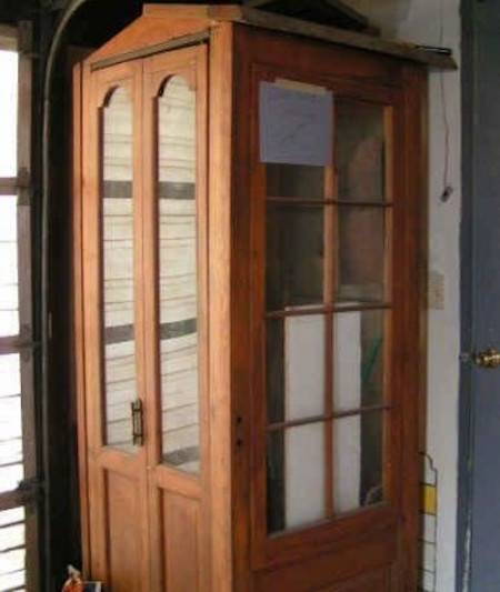 phone booth made of old French doors