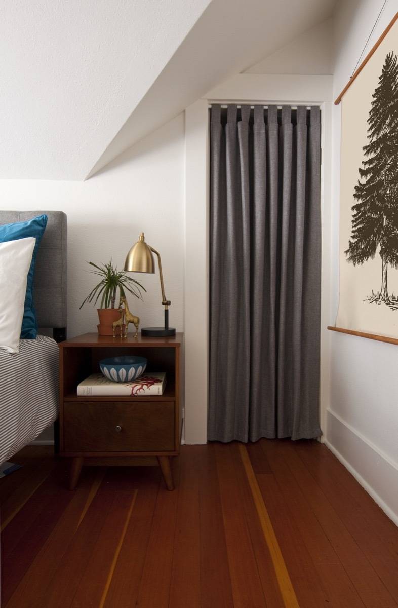 Closet, bedside table, bed and DIY framed wall art
