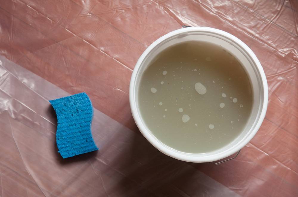 cleaning wood floor with a spunge