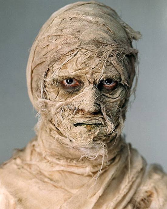 A person is dressed like an angry mummy.