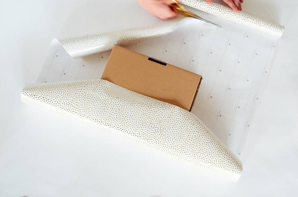 decorating white paper with a brown box