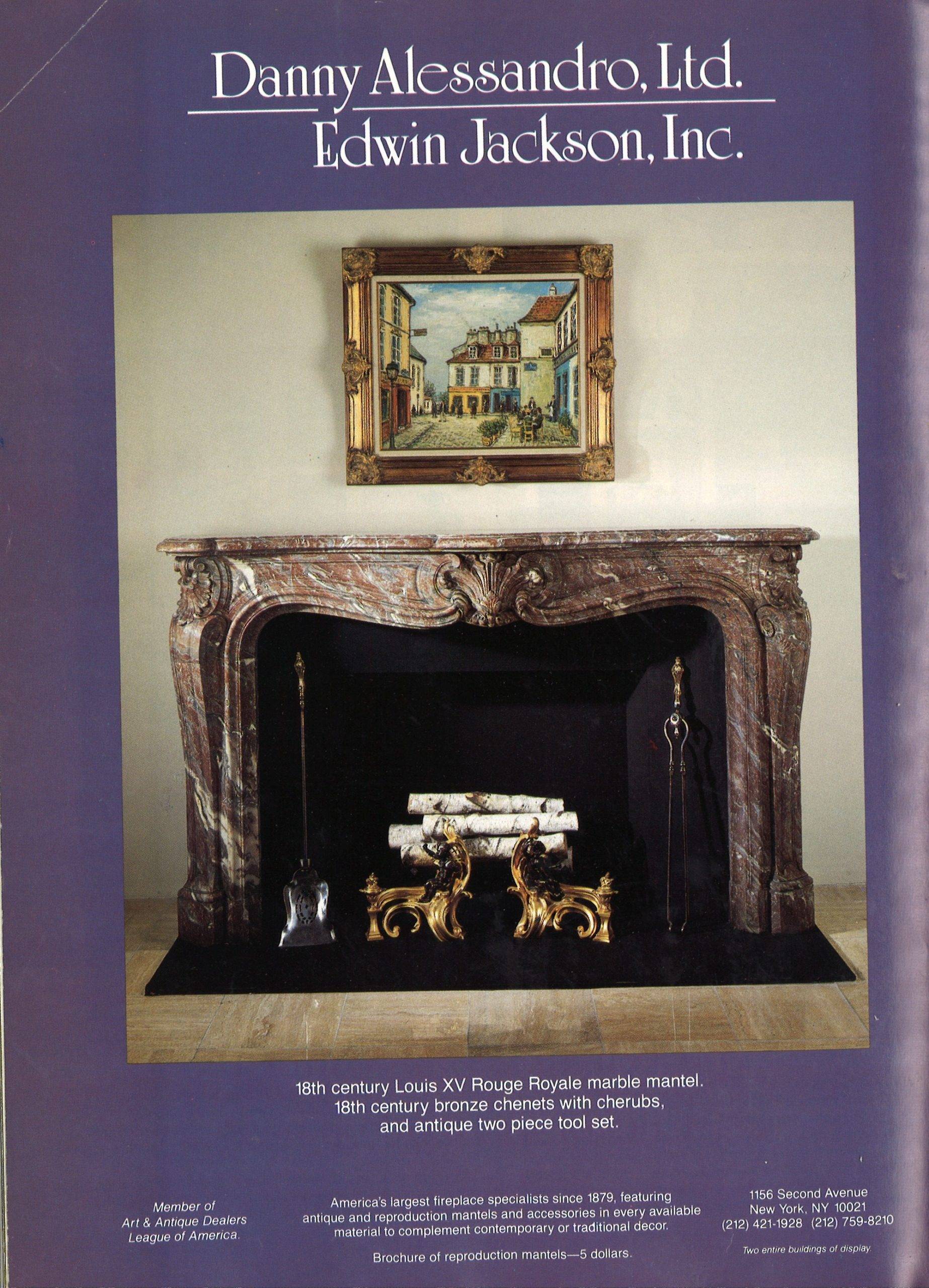 Gilded frame portrait of a house overhanging a stone fireplace.