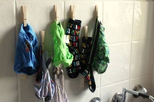 Use clothes pins as drying hooks for socks and underwear