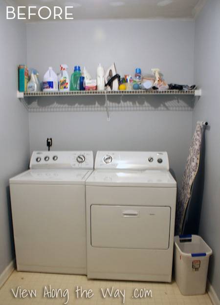 A washer and drying in a laundry room with a shelf above filled with cleaning supplies.