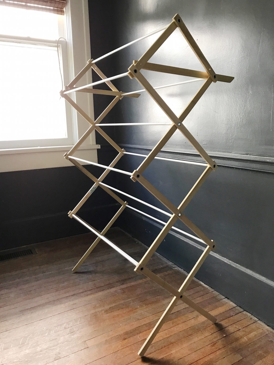 How to: Repurpose an Old Drying Rack into a Stylish Magazine Rack - Curbly