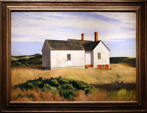 photo frame showing a house surrounded by meadow