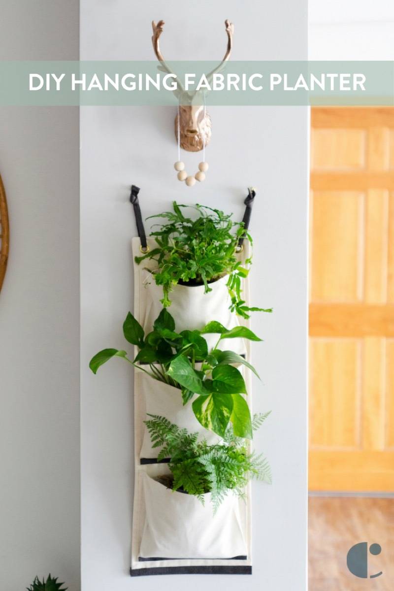 Do your plants drive you up a wall? If not, learn how to make this DIY hanging fabric planter!