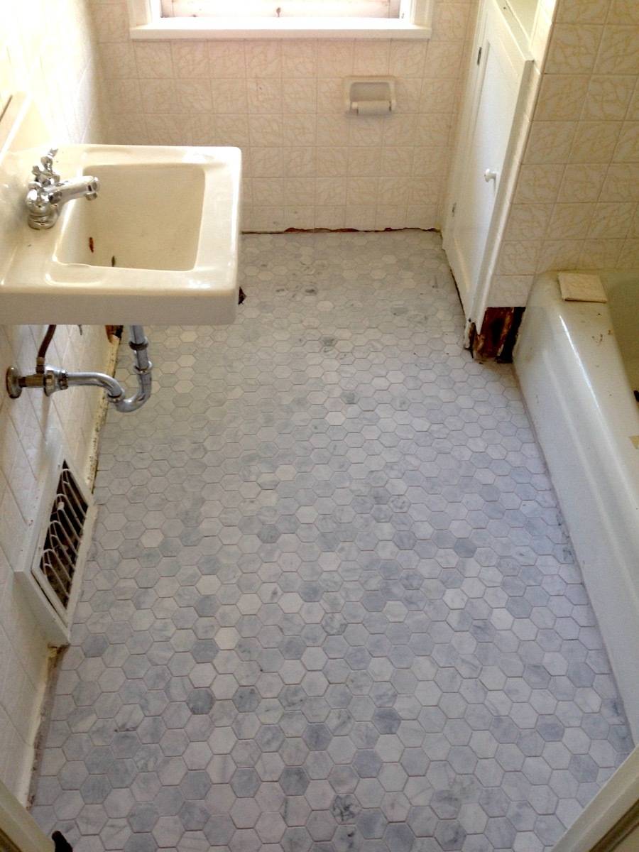 bathroom tiles and old sing and bathtub