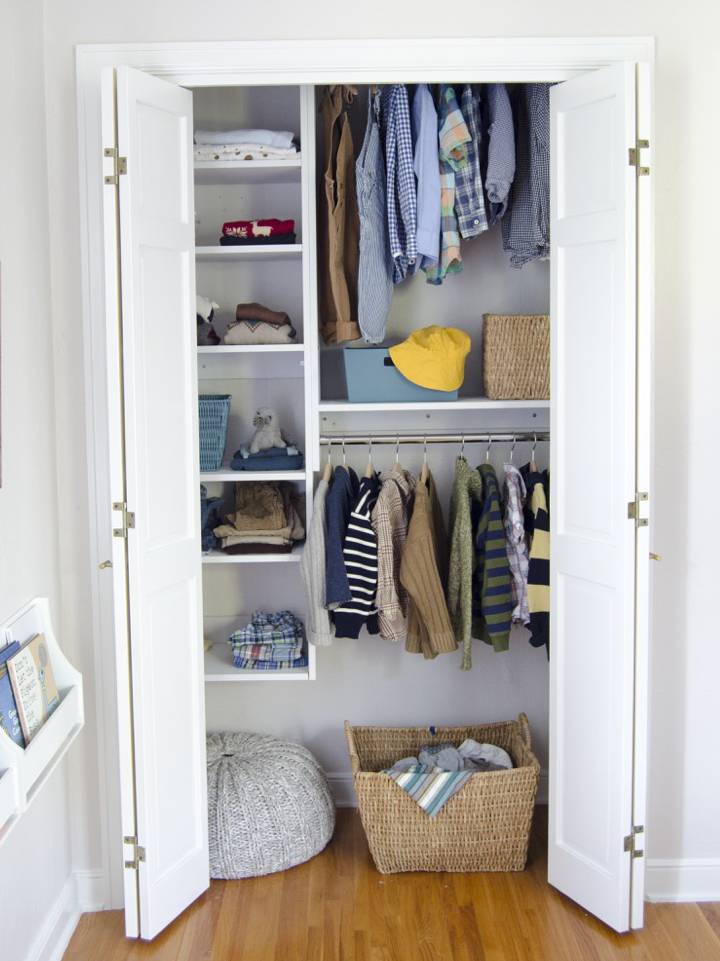 A closet opens to reveal clothing and accessories in it.
