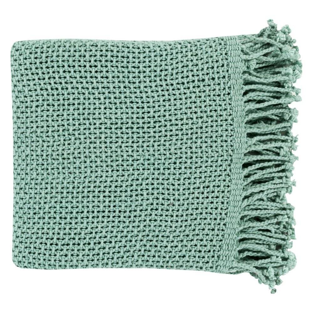 A folded bright green towel with frayed edges