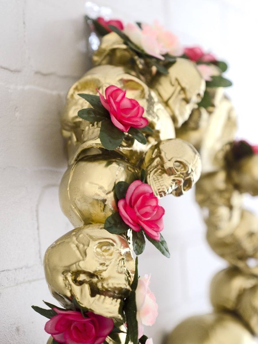 Go glam for Halloween with this gold skull wreath