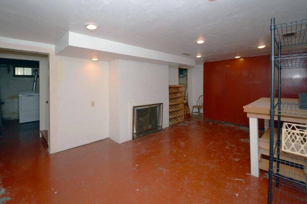 Shiplap accent wall decoration making an ugly basement look like new.