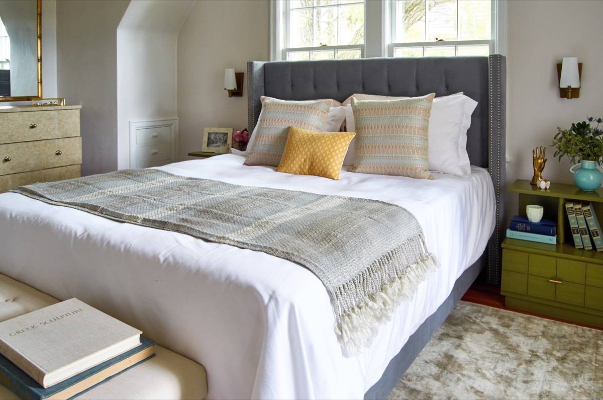 Bed with wall sconces