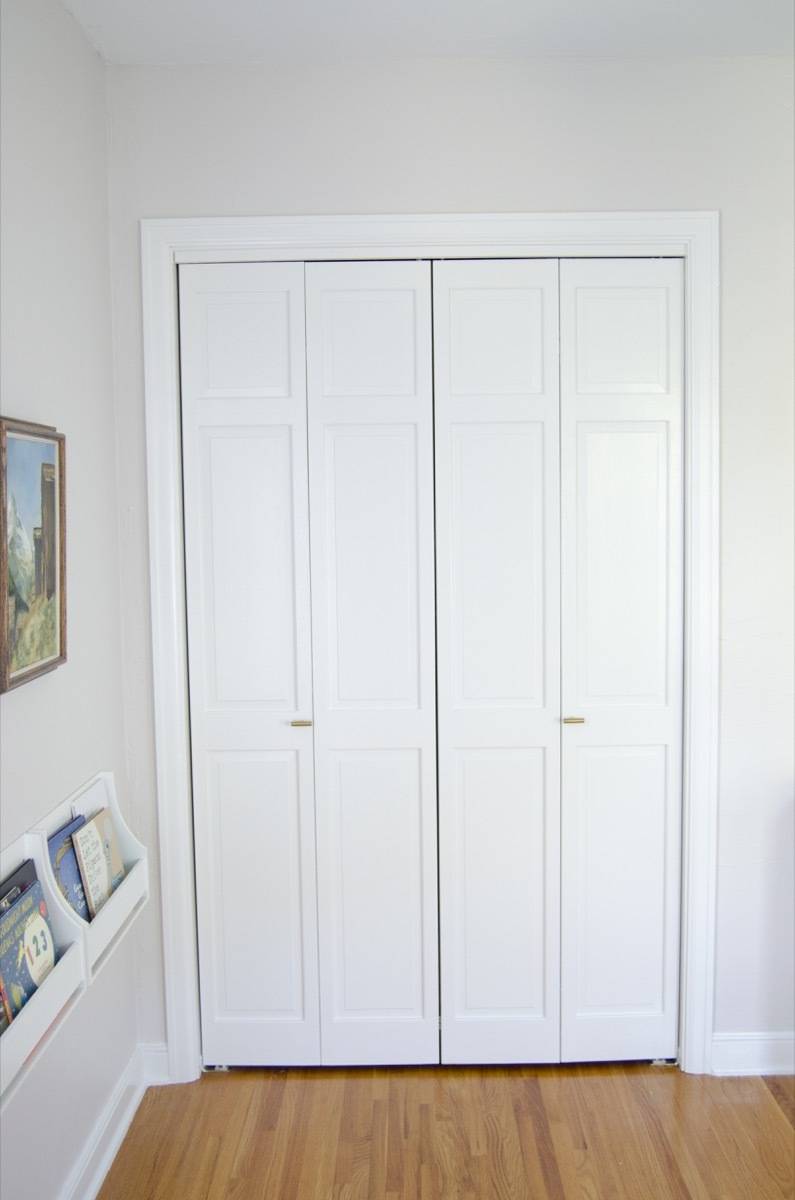 Closed white closet doors.