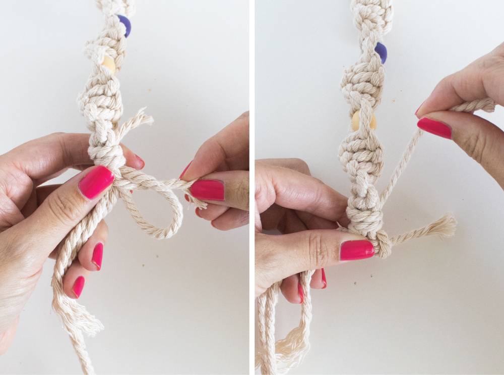 A woman's hands tying a knot with some thin rope and then pulling it tight.