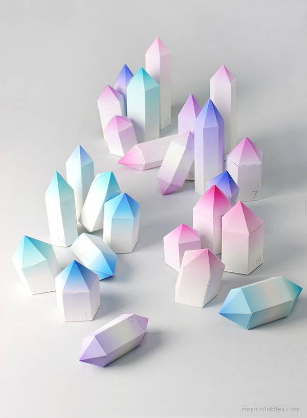 Many crystal shaped white and blue, white and pink, white and purple and white and green pieces.