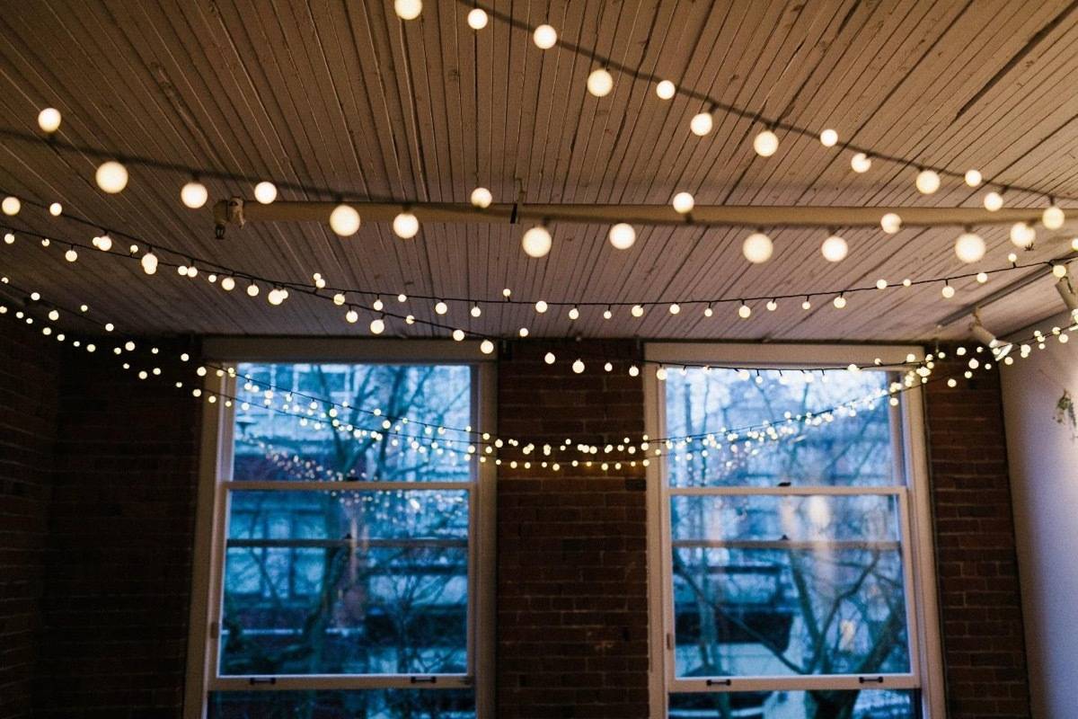 11 Scandinavian Lighting Tricks to Fill Your Home With Hygge | Use string lights to create a festive atmosphere