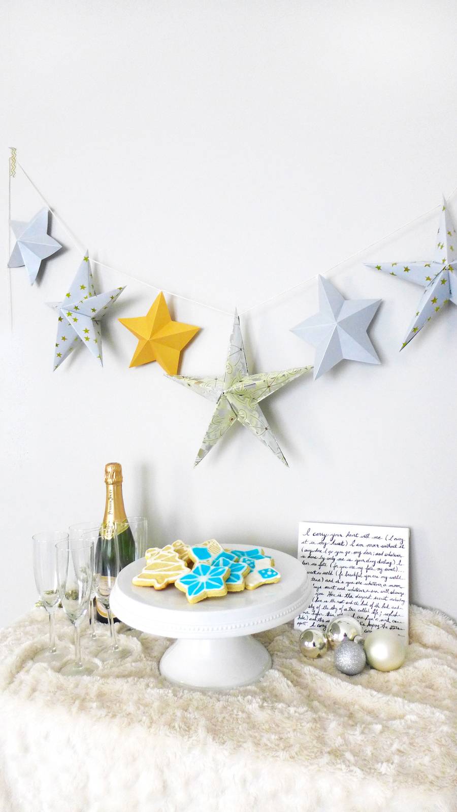 Wine and other things sit on a counter under a star banner.