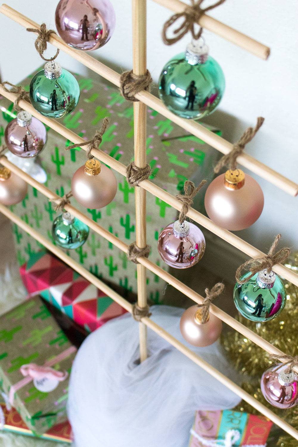 Wooden dowels made to look like a decorated christmas tree.