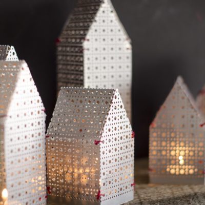 DIY holiday luminaries made from an aluminum sheet and thread