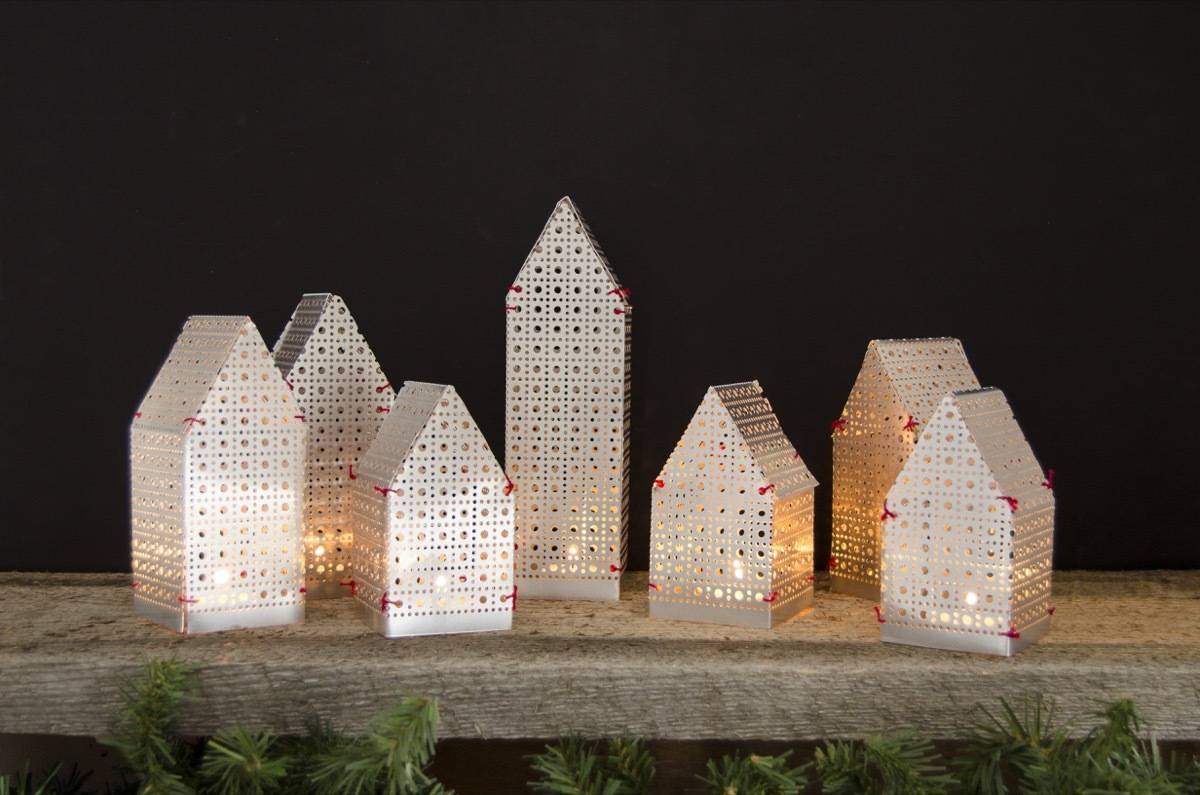 Make these house-shaped luminaries to warm up your mantel