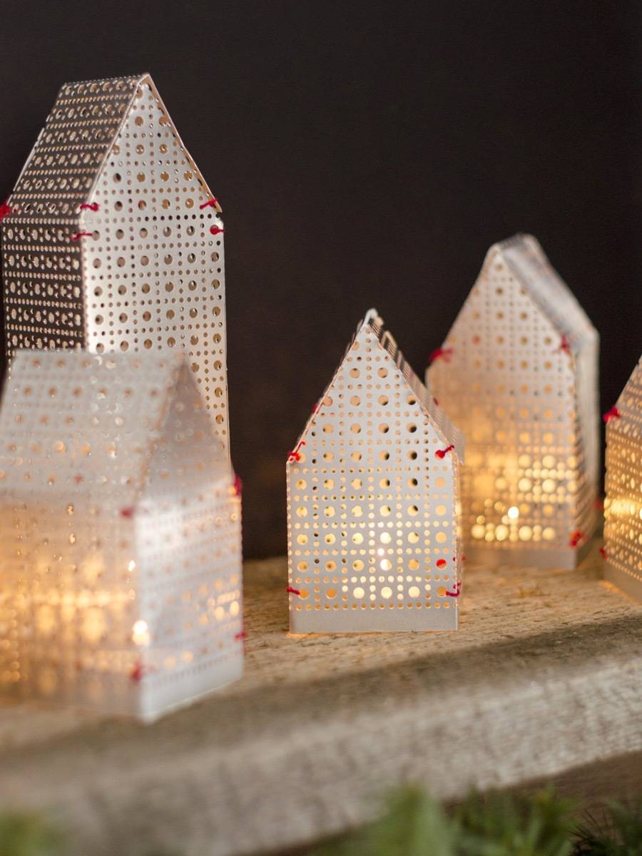 So festive! These house-shaped luminaries were made from a single sheet of metal!