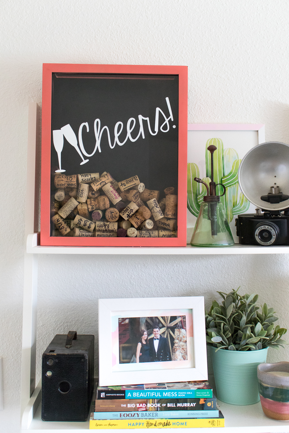 Pictures and decorations on a shelf.