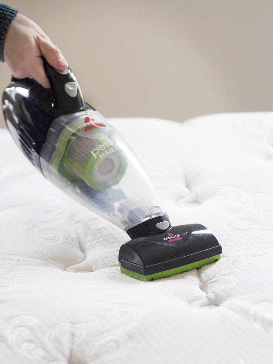 How to Clean your Mattress: Strip and vacuum the mattress