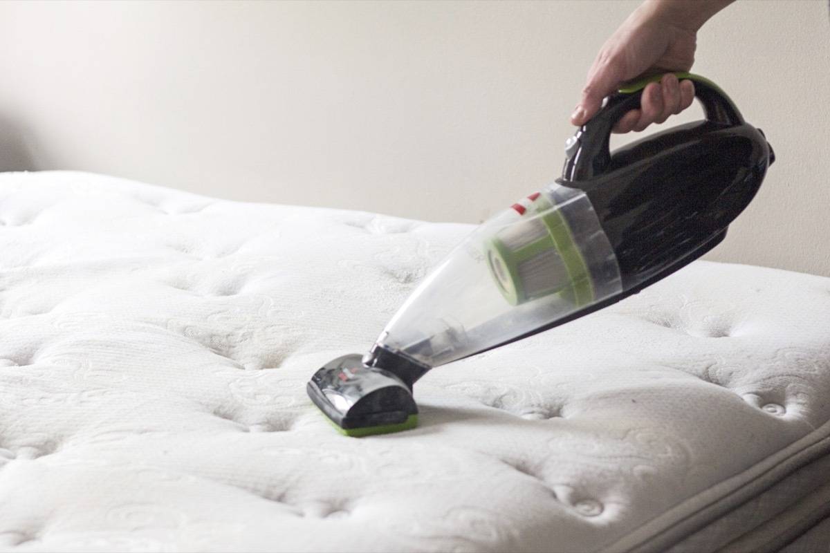 How to Clean your Mattress: Vacuum baking soda to remove moisture