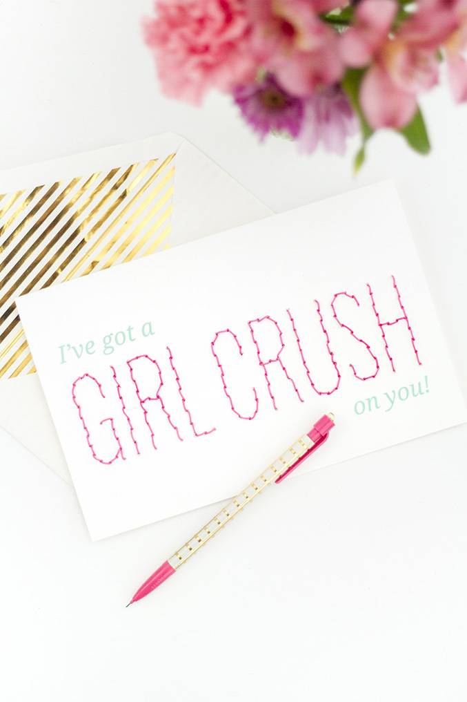 A pen is sitting near a note that says Girl Crush.