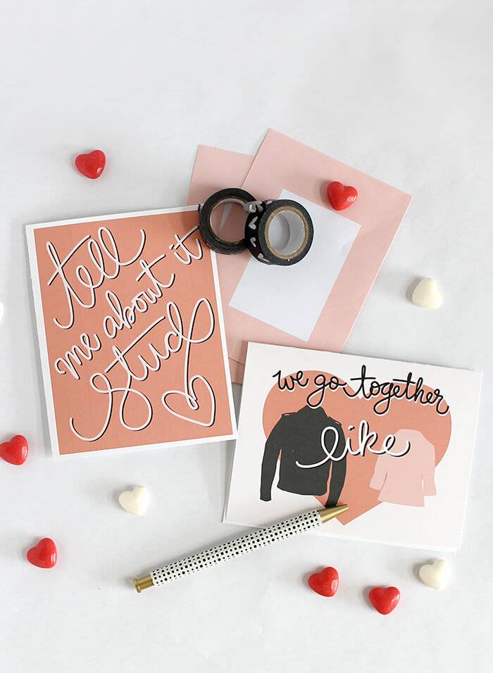 Valentine cards with little red and white hearts spread around.