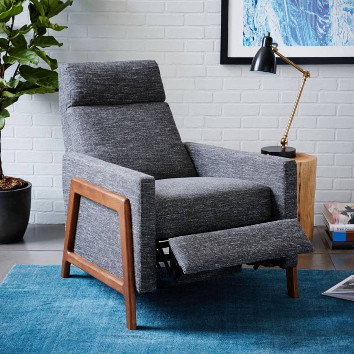 Get back pain relief from a recliner, like this gray one from West Elm