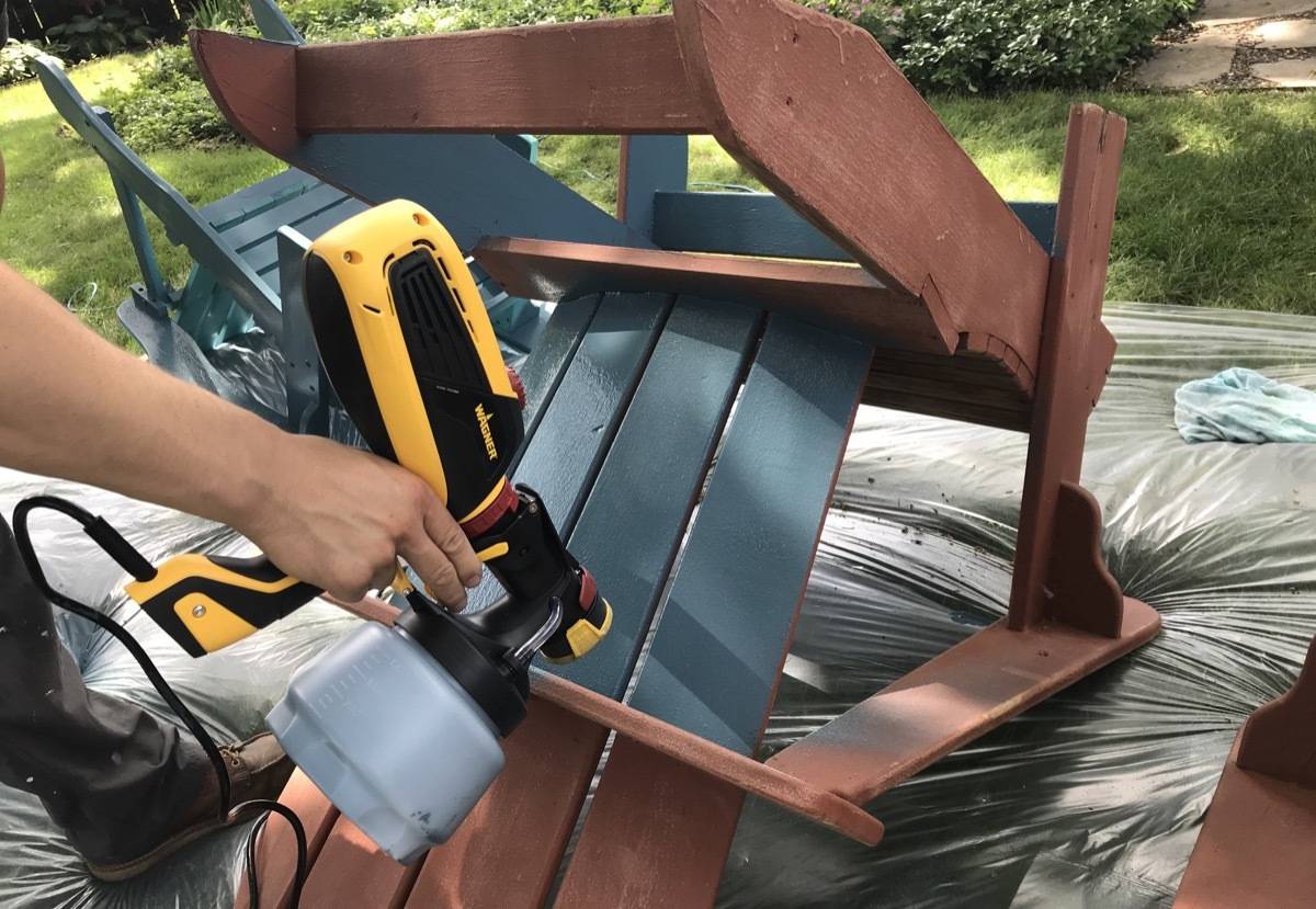 Spraying a patio chair with a Wagner Paint Sprayer