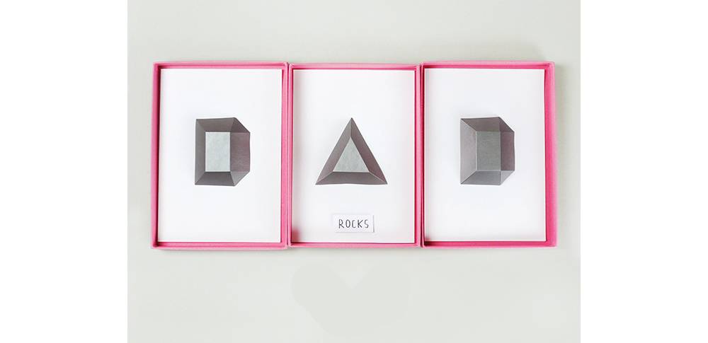 The word Dad is spelled out in pictures in pink frames.