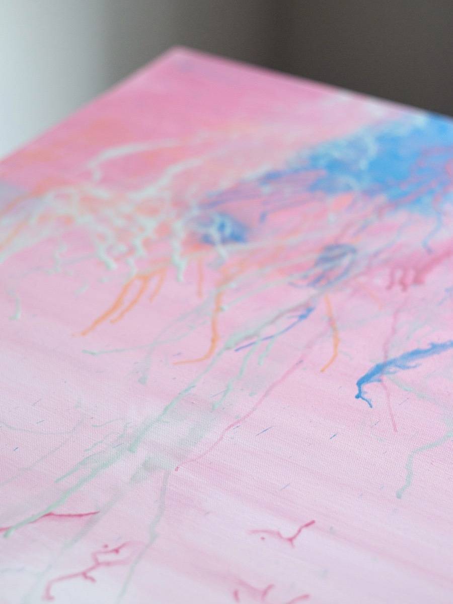 A painting with pink and other colors on it.