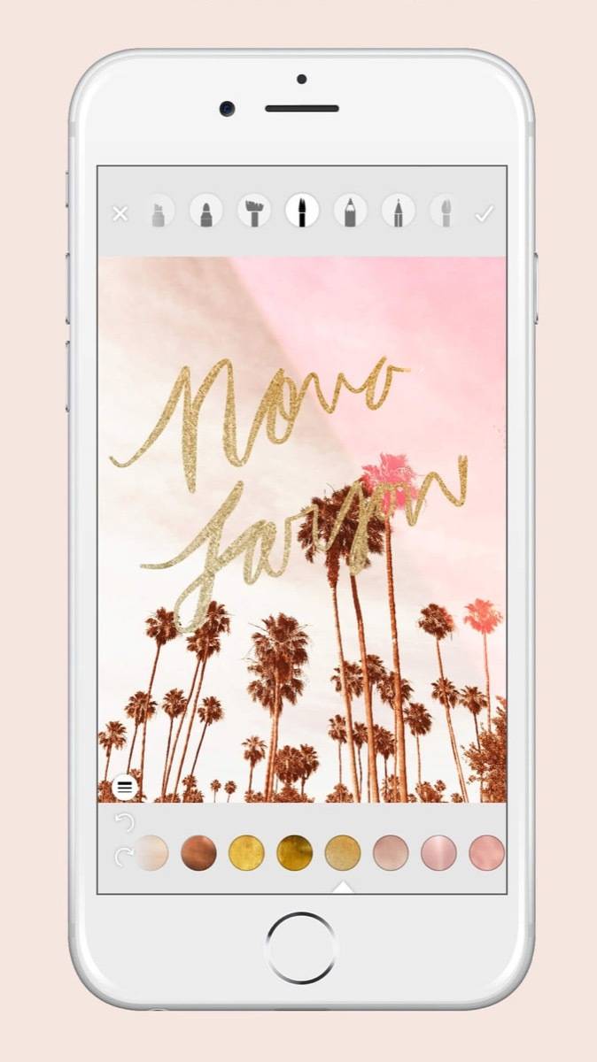 A pink screen with trees is showing on a white phone.