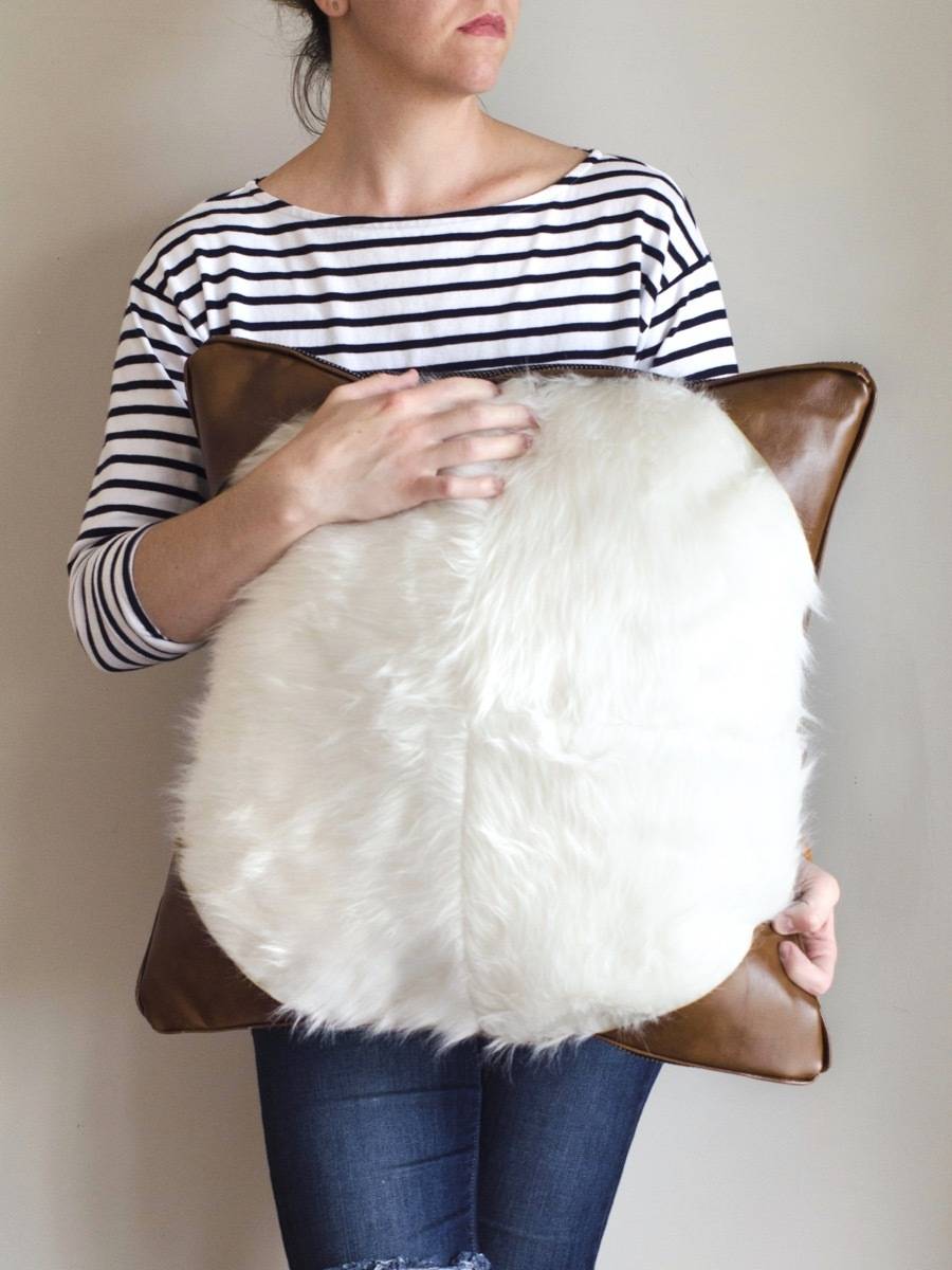 Woman holding DIY pillow