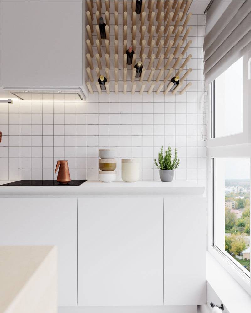 A well lit kitchen area with white walls.