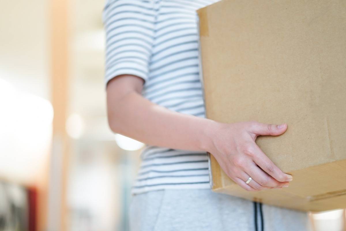 Woman carrying box