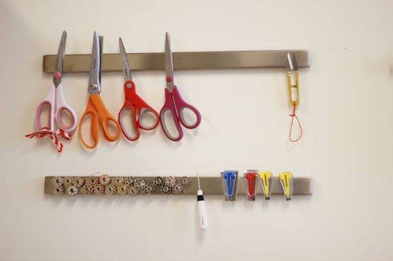 Store sewing tools and notions on a magnetic knife strip