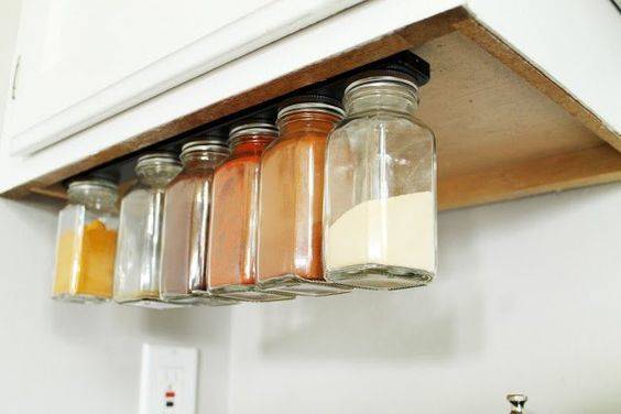 Store items in small jars on a magnetic knife strip.