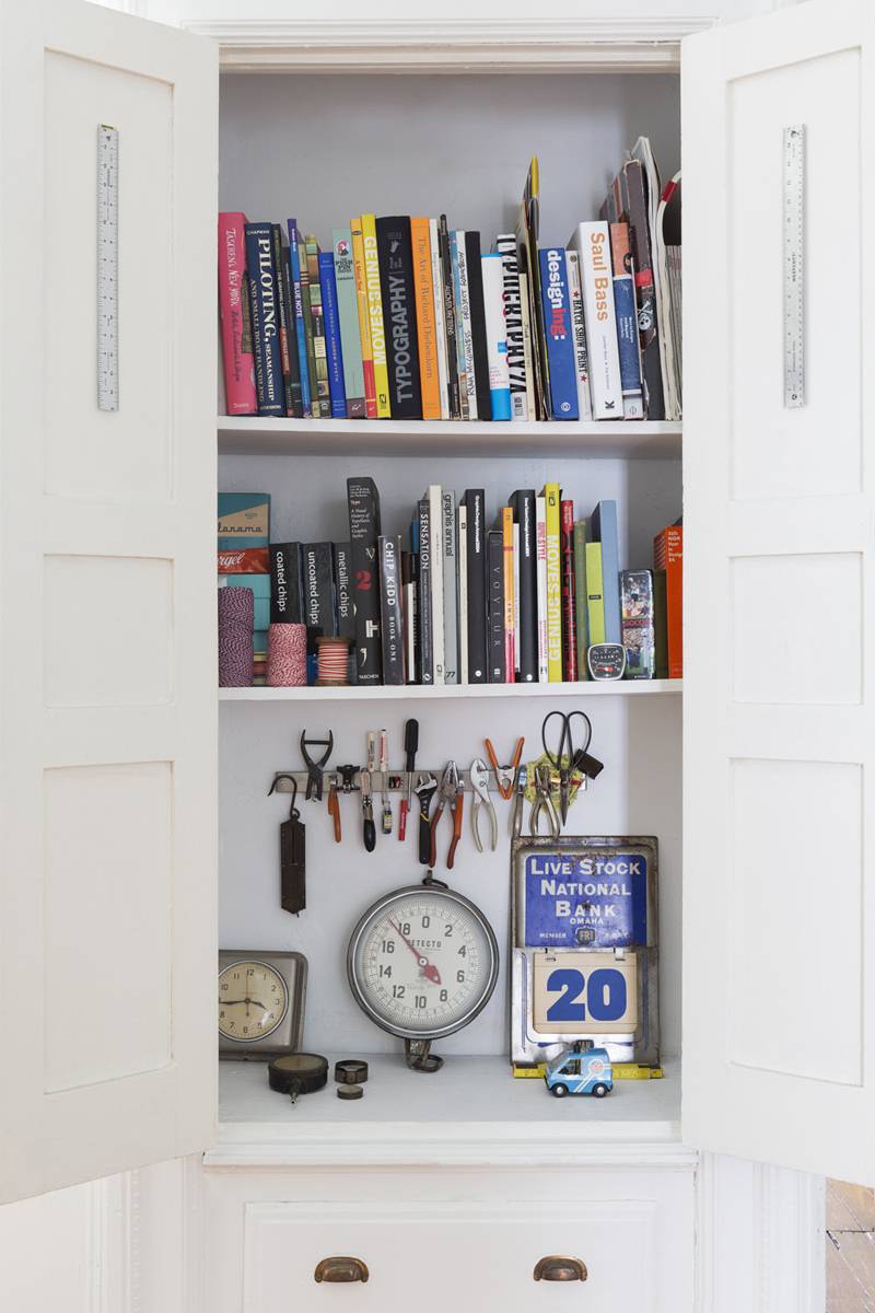 A magnetic knife strip used to store small tools inside a cabinet