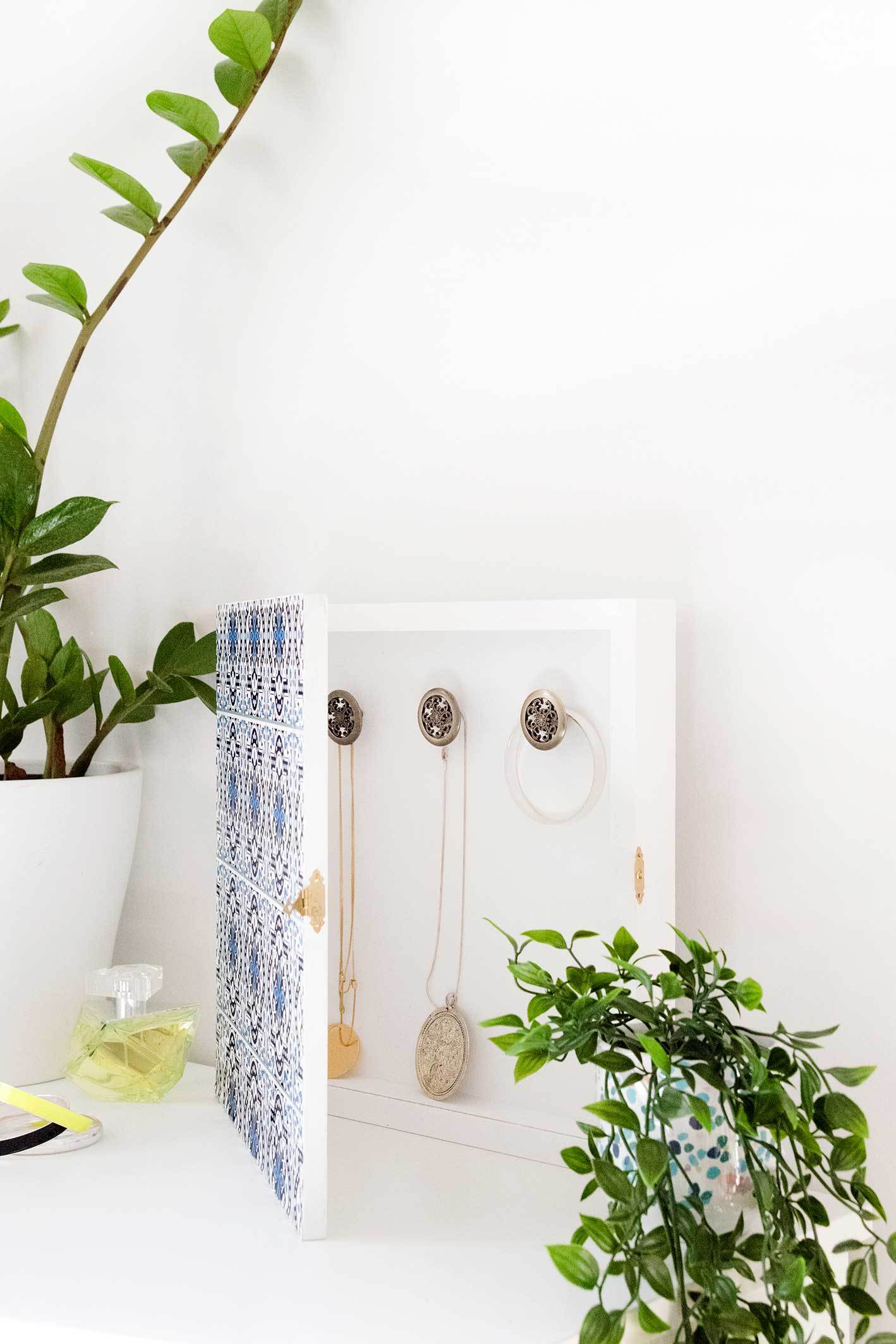Jewelry organizer cleverly disguised as wall art