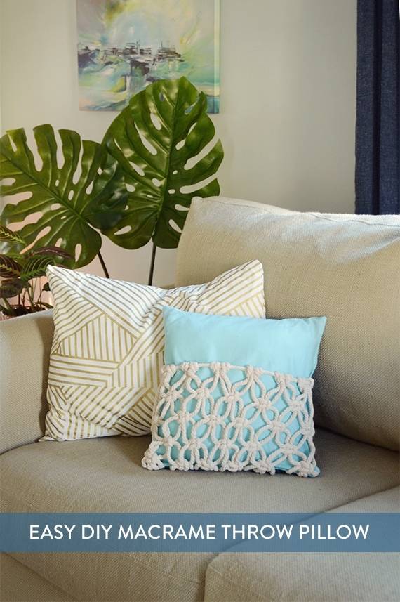 Macrame throw pillows on a beige couch.