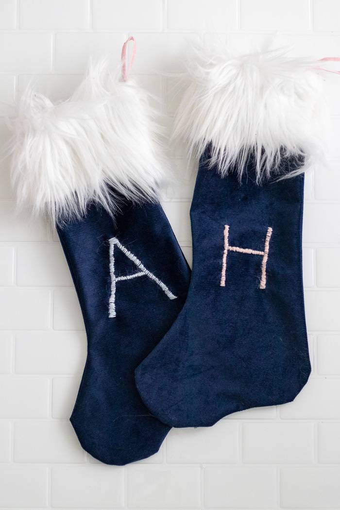 Blue and white stockings embroidered with the letters A and H.
