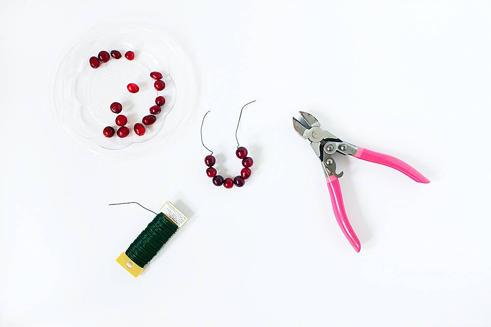 A tool with pink handles used with beads.