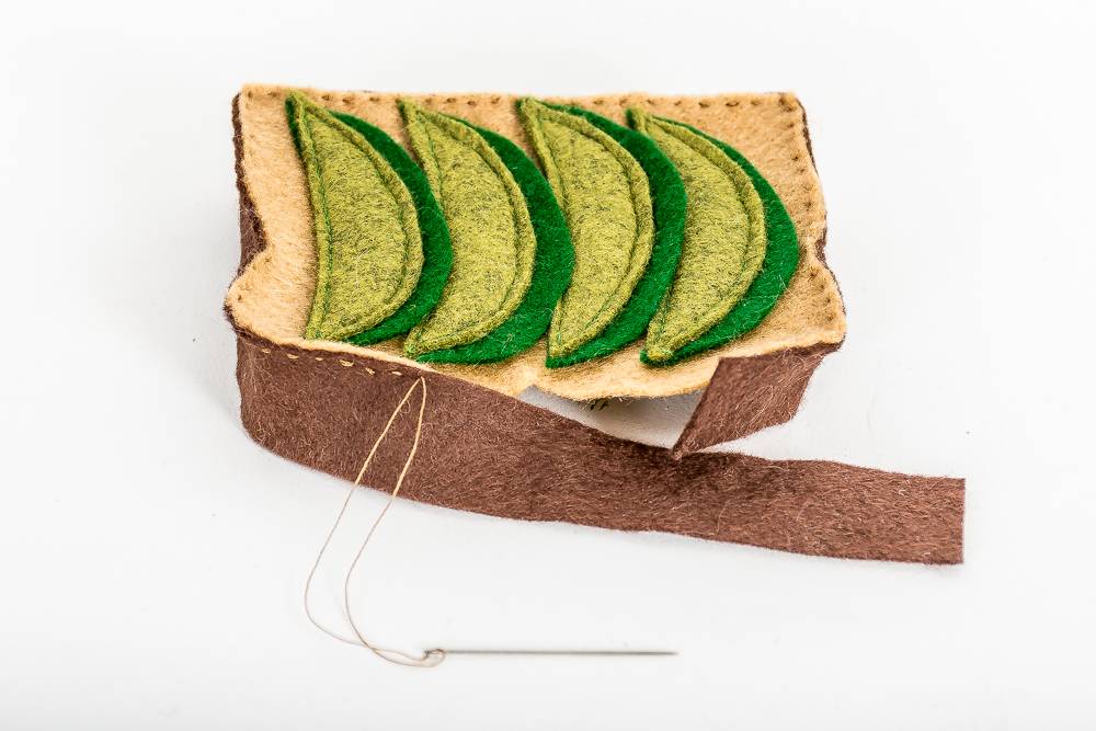 Sewing a felt avocado toast ornament