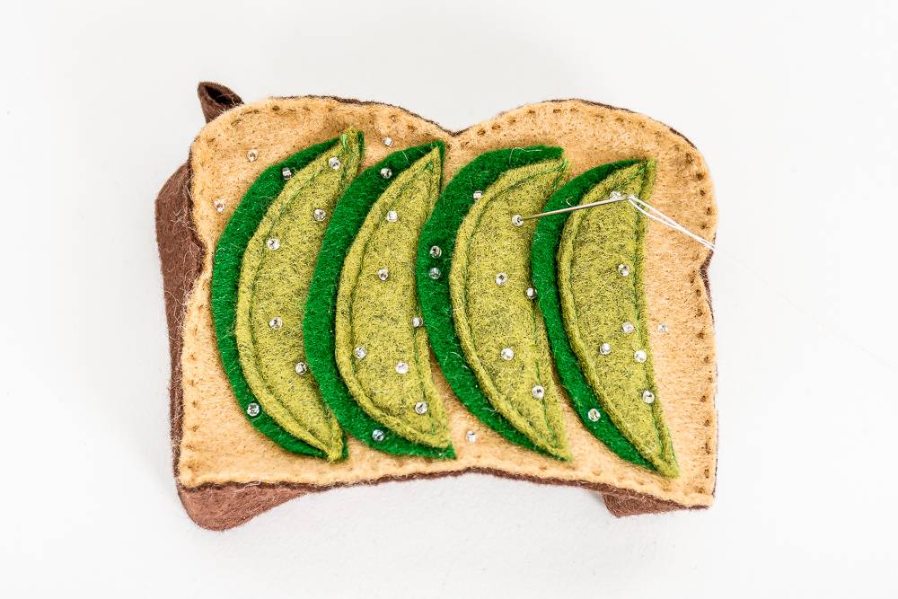 Sewing a felt avocado toast ornament